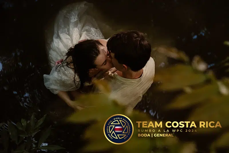 Romantic embrace in the water Couple embracing in shallow water during romantic photo session in Costa Rica