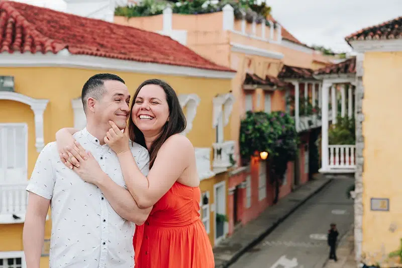 Meet Joice & Diego: Destination Wedding Photographers in Costa Rica Wedding photographers Joice and Diego, hugging and laughing happily together.