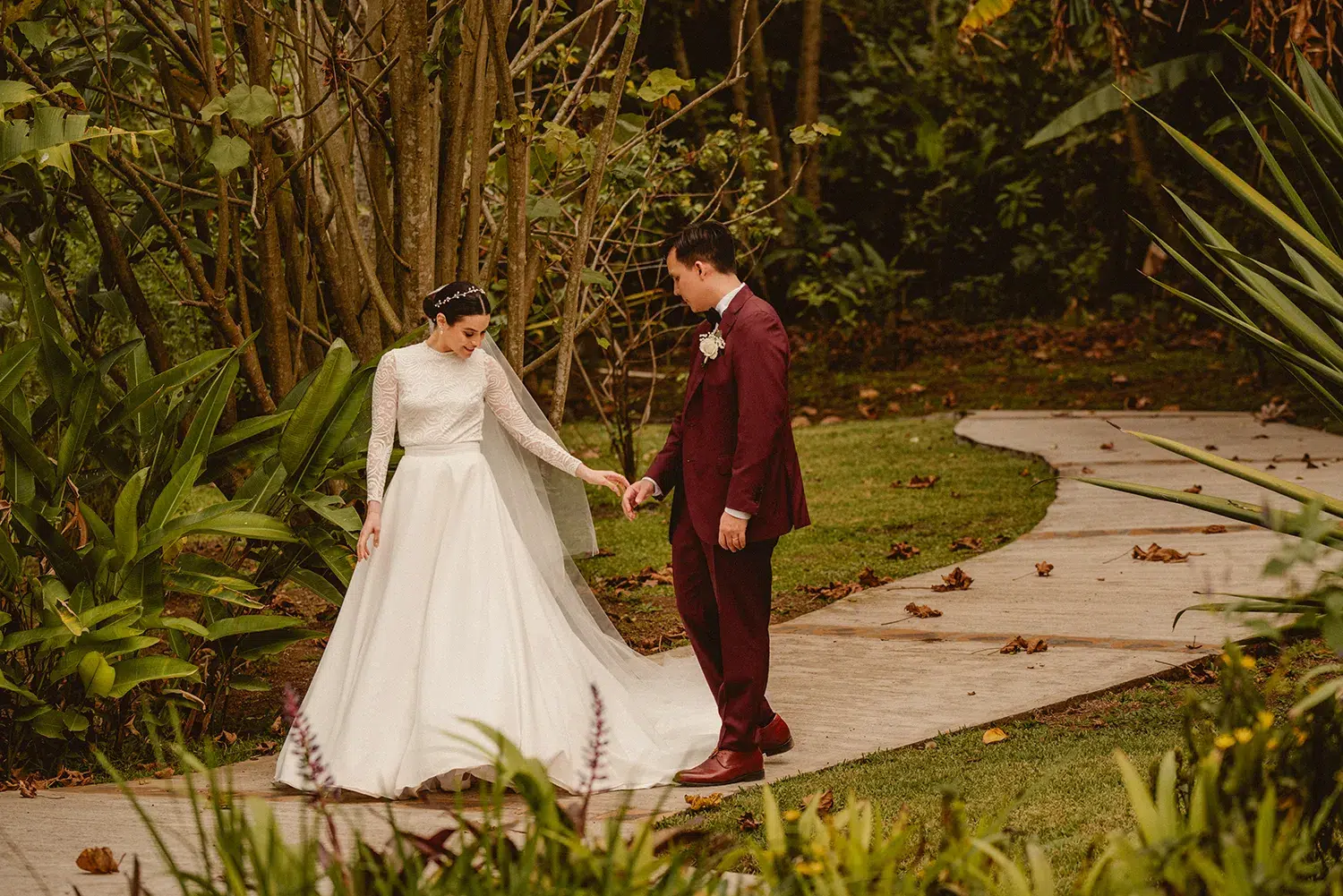 Bride and groom holding hands outdoors in a garden setting. Costa Rica Wedding Photographer. Monteverde, La Fortuna, Manuel Antonio, Tamarindo, Puerto Viejo, Uvita