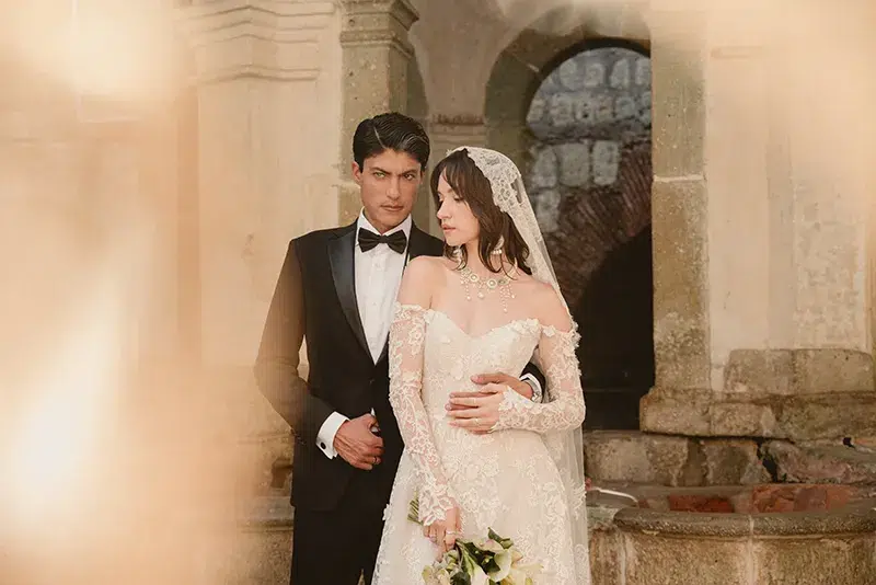 ntense Wedding Portrait of a Couple Couple embracing, groom looking intensely at the camera.