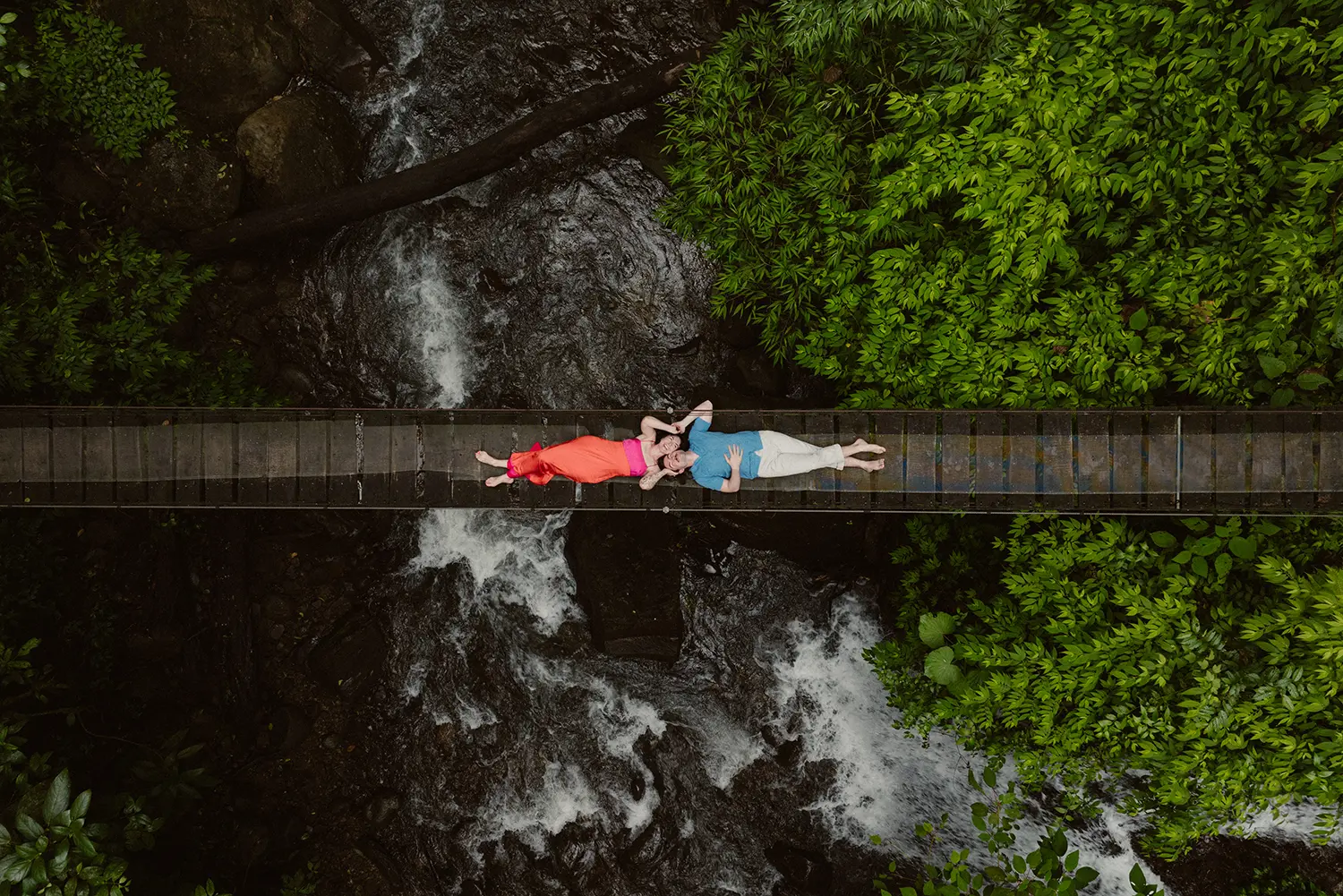 Drone view over a river and waterfall surrounded by lush green forest in El Tigre Waterfall, Monteverde, La Fortuna, Manuel Antonio, Tamarindo, Puerto Viejo Costa Rica.