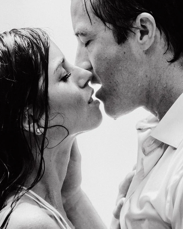 Black and white photo by a La Fortuna wedding photographer of newlyweds sharing an intimate kiss, Costa Rica destination wedding