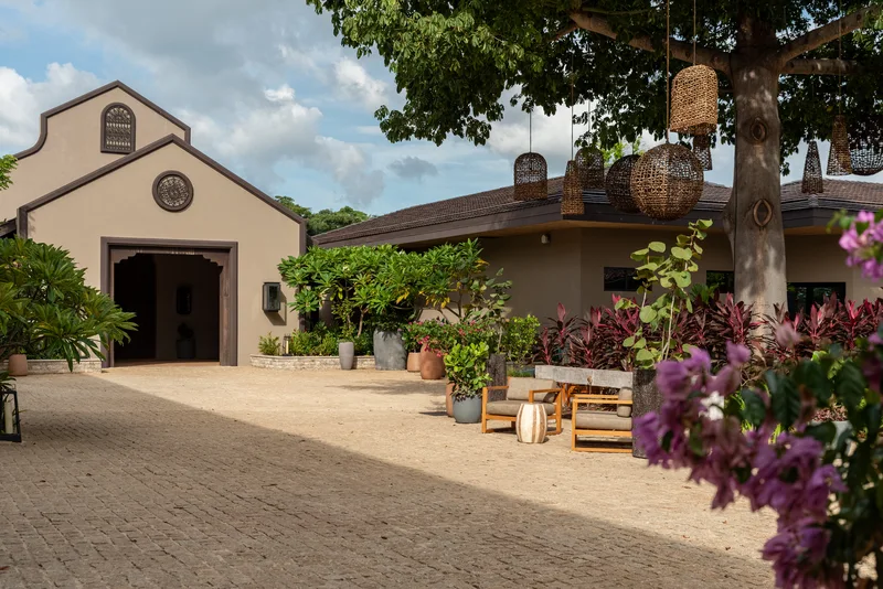Terracotta-roof hacienda with tropical garden and bougainvillea at Nekajui Ritz-Carlton Reserve, Guanacaste
