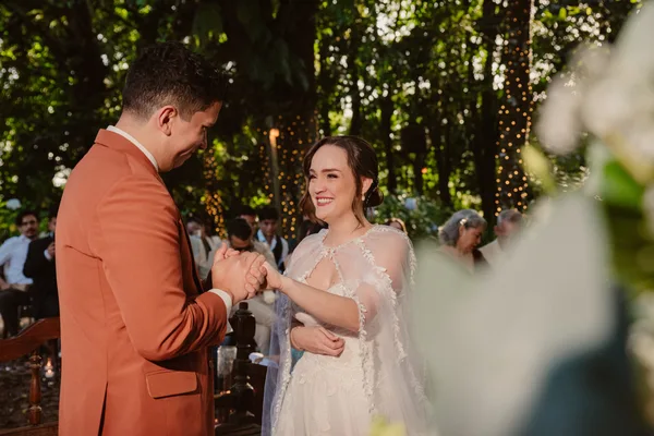 Couple reading personalized vows at a civil ceremony in Monteverde
