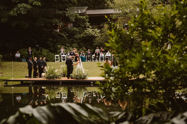 Couple holding their provisional marriage statement after their Costa Rica wedding