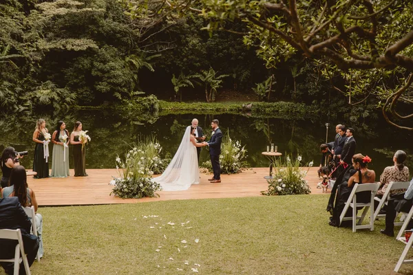 Witnesses signing the marriage record at a civil wedding in Costa Rica